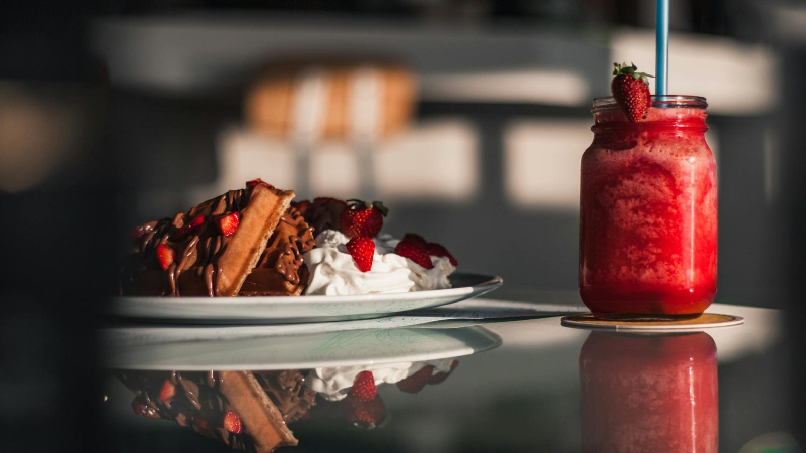 clear glass jar filled with red smoothie